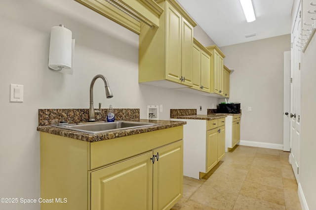 kitchen with sink and cream cabinetry