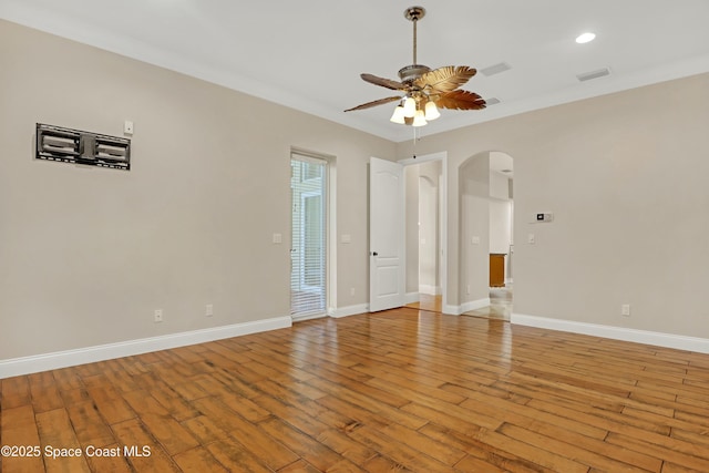 unfurnished room featuring crown molding, ceiling fan, and light hardwood / wood-style flooring