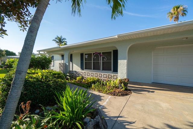 view of exterior entry featuring a garage