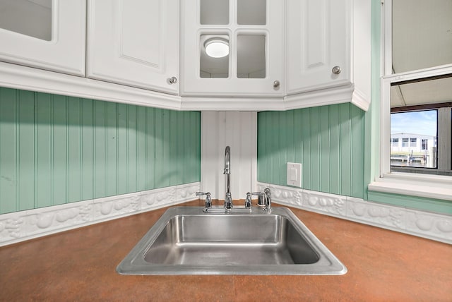 kitchen with white cabinetry and sink