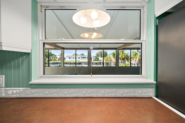 details featuring concrete flooring and a water view