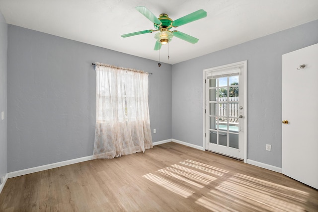 empty room with light hardwood / wood-style floors and ceiling fan