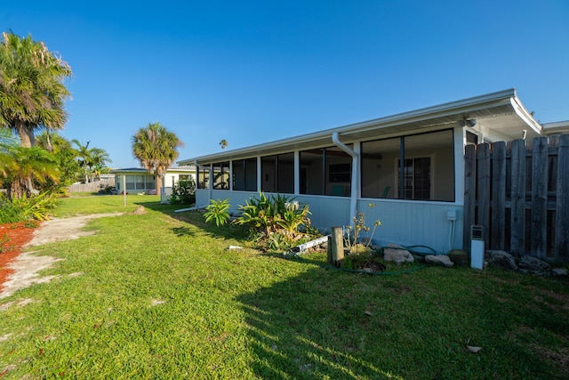 view of yard featuring a sunroom