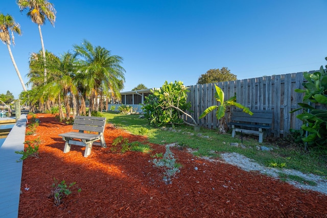 view of yard with a sunroom