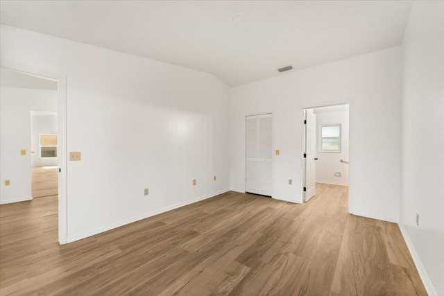 unfurnished room with light wood-type flooring