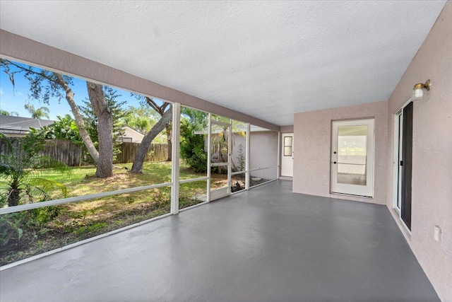 unfurnished sunroom featuring a healthy amount of sunlight