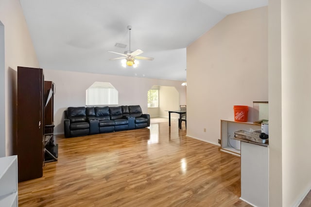 1632 Cains Ave NW, Palm Bay, FL 32907 - living room with a ceiling fan, lofted ceiling, and light wood-type flooring