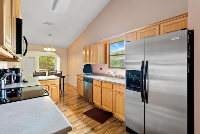 1632 Cains Ave NW, Palm Bay, FL 32907 - kitchen featuring visible vents, light brown cabinetry, light countertops, a sink, and appliances with stainless steel finishes