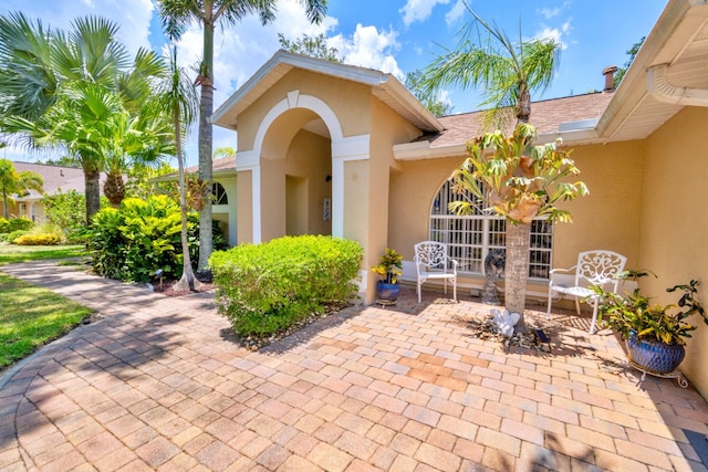 doorway to property featuring a patio area