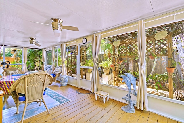 sunroom featuring ceiling fan