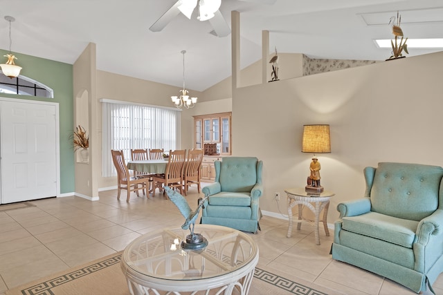 living room featuring tile floors, high vaulted ceiling, and ceiling fan with notable chandelier