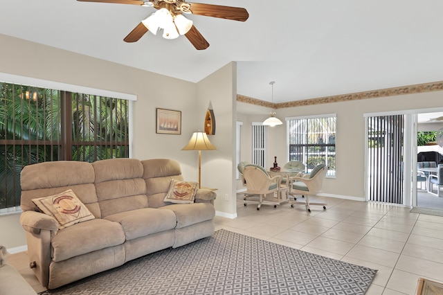 tiled living room featuring ceiling fan and a wealth of natural light