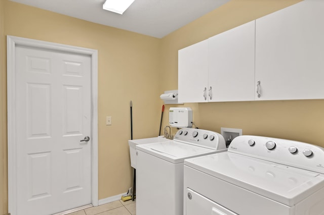 laundry area with cabinets, independent washer and dryer, hookup for a washing machine, and light tile floors