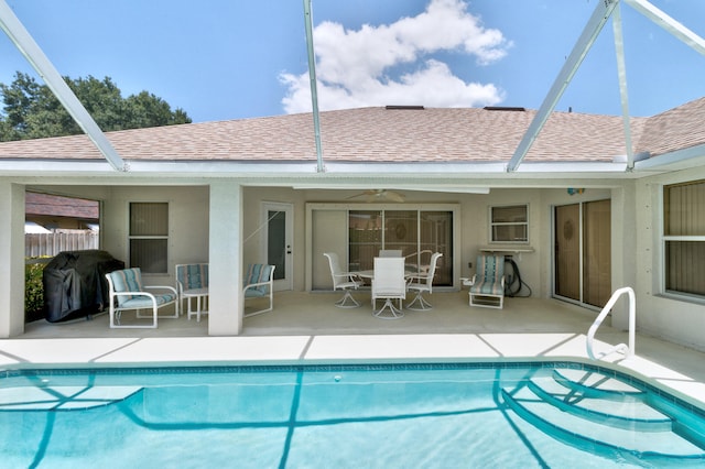 view of pool featuring ceiling fan, a grill, a lanai, and a patio area