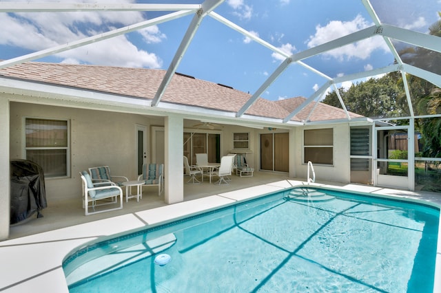 view of pool with a patio area, a lanai, and ceiling fan