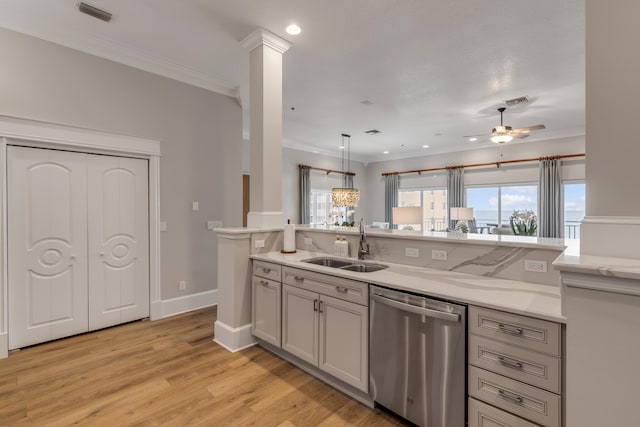 kitchen featuring hanging light fixtures, light wood-type flooring, stainless steel dishwasher, sink, and ceiling fan