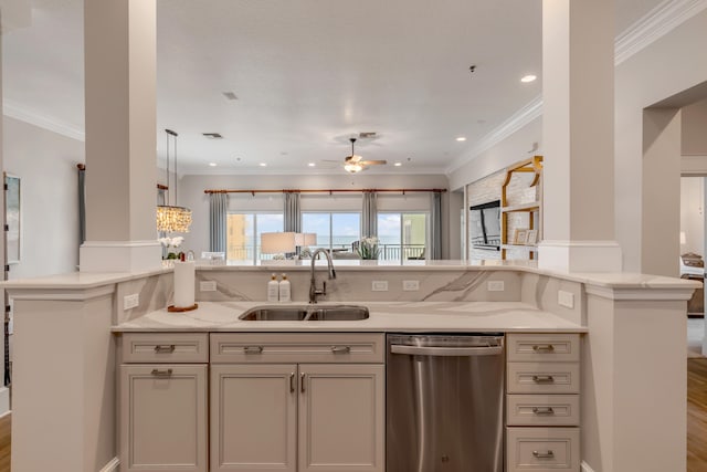 kitchen featuring stainless steel dishwasher, ceiling fan with notable chandelier, sink, hardwood / wood-style flooring, and ornamental molding