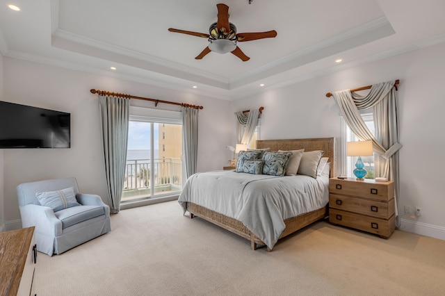 bedroom with access to outside, ceiling fan, a raised ceiling, and carpet floors