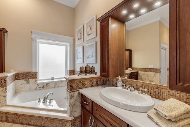 bathroom featuring vanity with extensive cabinet space and tiled tub