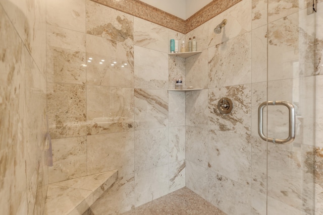 details featuring a shower with shower door