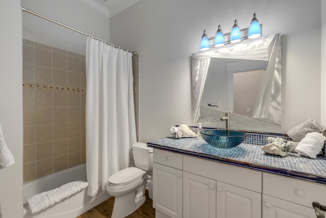 full bathroom with ornamental molding, shower / bath combo with shower curtain, wood-type flooring, vanity, and toilet