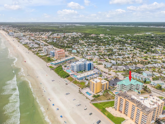 aerial view featuring a view of the beach and a water view