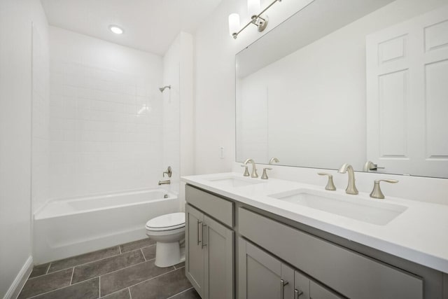 full bathroom featuring double vanity, tile patterned flooring,  shower combination, and toilet