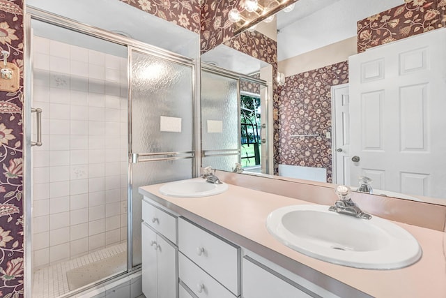 bathroom featuring vanity and an enclosed shower