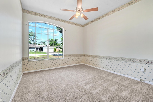 unfurnished room with carpet and ceiling fan