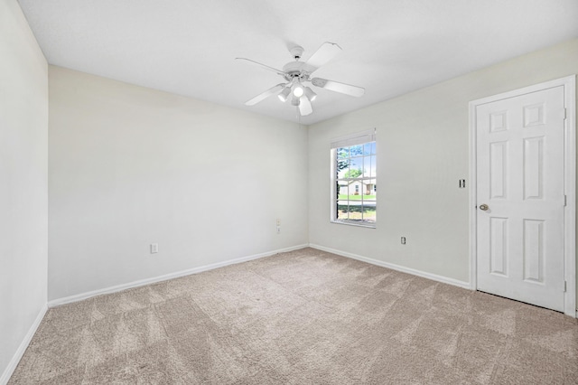 carpeted empty room with ceiling fan