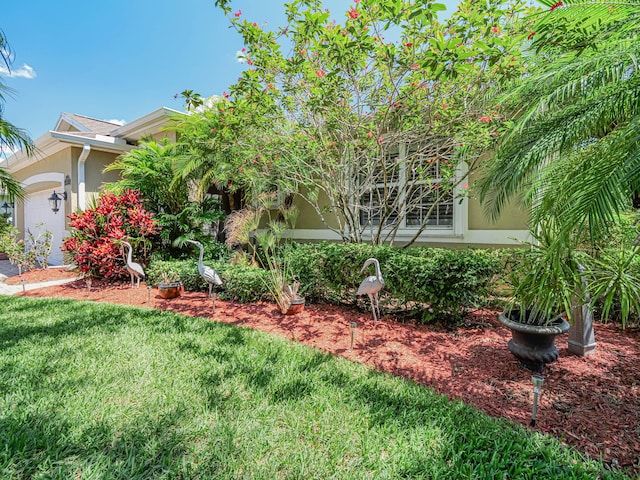 view of yard with a garage