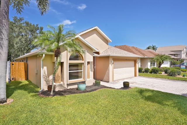 view of front of home featuring a garage and a front yard