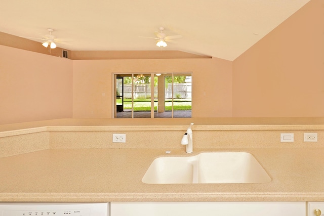 kitchen featuring ceiling fan, lofted ceiling, sink, and white dishwasher