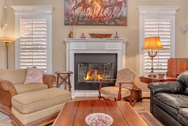 living area with plenty of natural light and light tile patterned floors