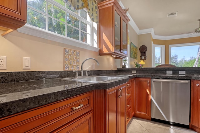 kitchen with dishwasher, ornamental molding, a healthy amount of sunlight, and sink