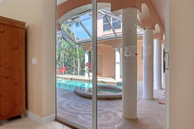 doorway with light tile patterned floors