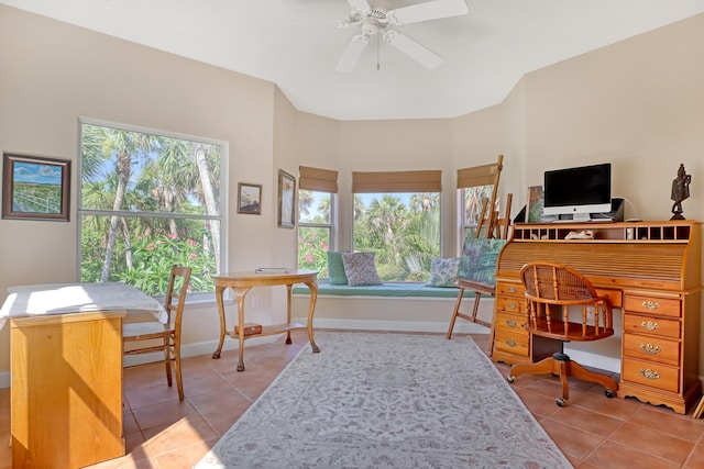 tiled office featuring ceiling fan