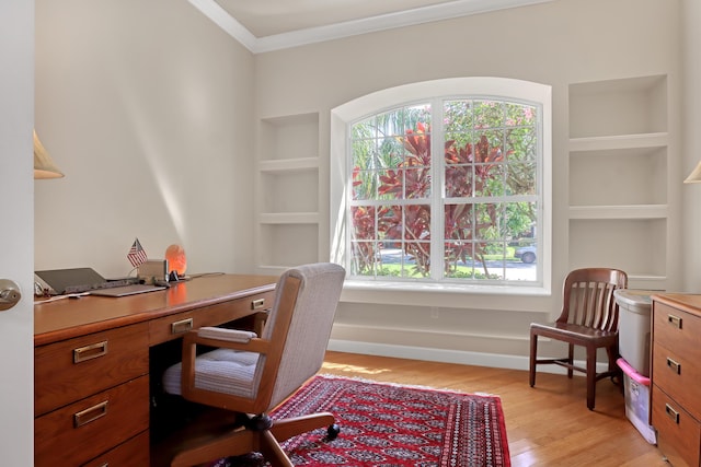 office featuring light wood-type flooring and ornamental molding