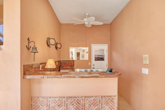 kitchen with ceiling fan and sink