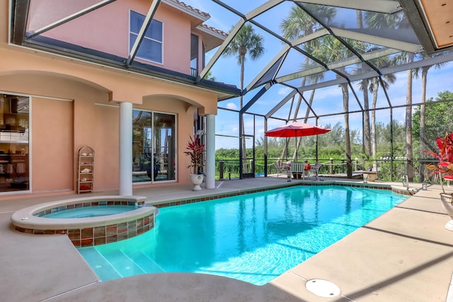 view of pool with glass enclosure, an in ground hot tub, and a patio