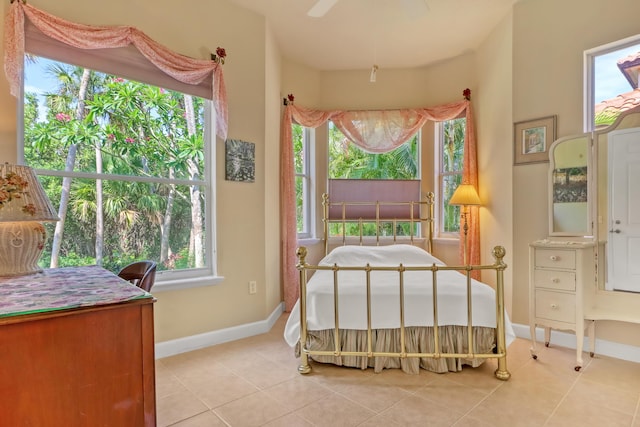 bedroom with light tile patterned floors and ceiling fan