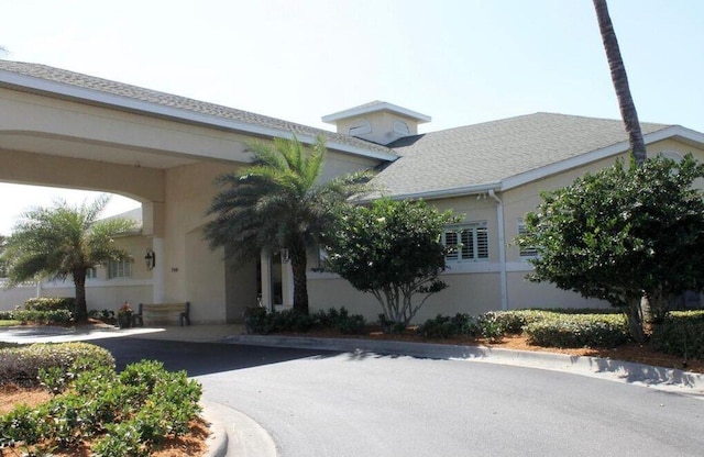 view of front of home featuring a carport