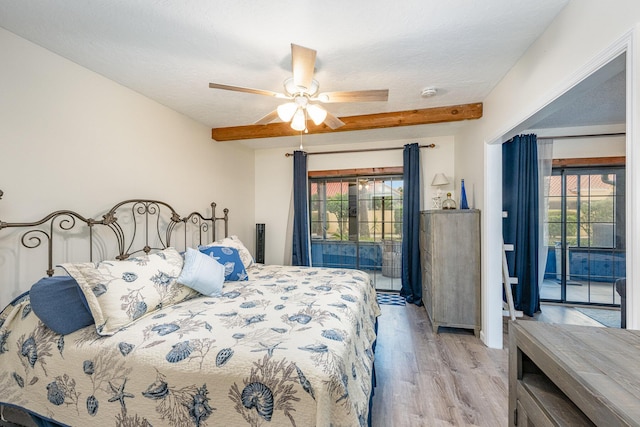 bedroom featuring access to exterior, ceiling fan, beamed ceiling, a textured ceiling, and light wood-type flooring