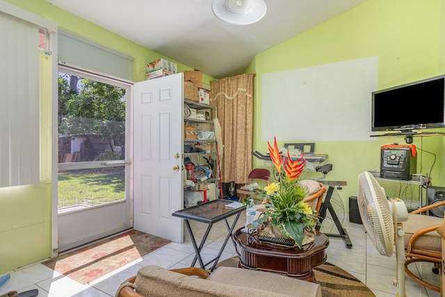 interior space featuring tile floors and lofted ceiling