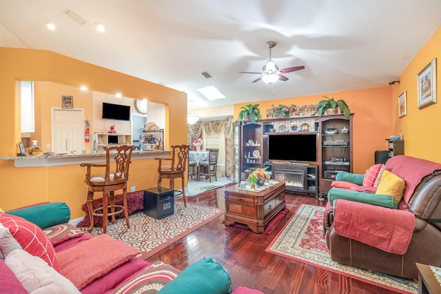 living room featuring hardwood / wood-style floors and ceiling fan