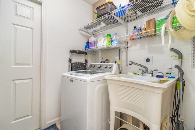 laundry room featuring sink and washer / clothes dryer