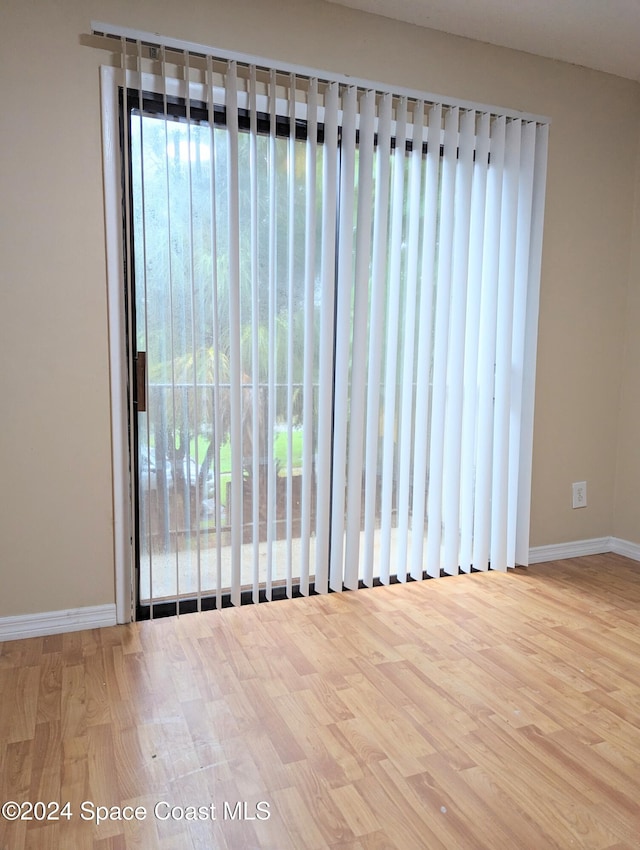 spare room with light hardwood / wood-style floors