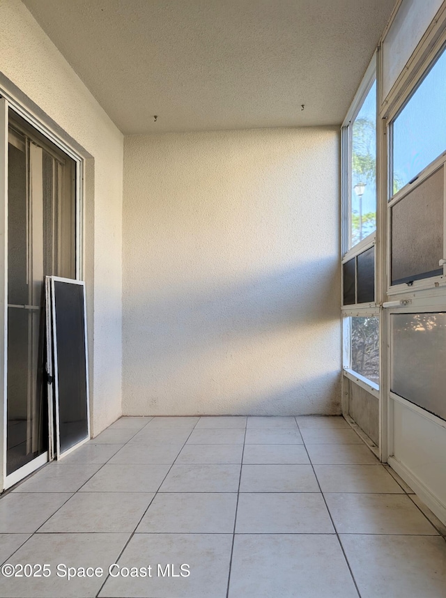 unfurnished sunroom featuring a healthy amount of sunlight