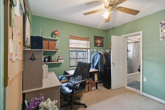 office featuring ceiling fan and light colored carpet