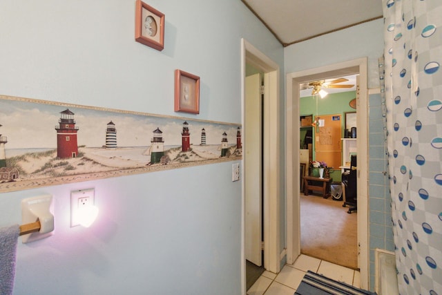 hall featuring light tile patterned floors